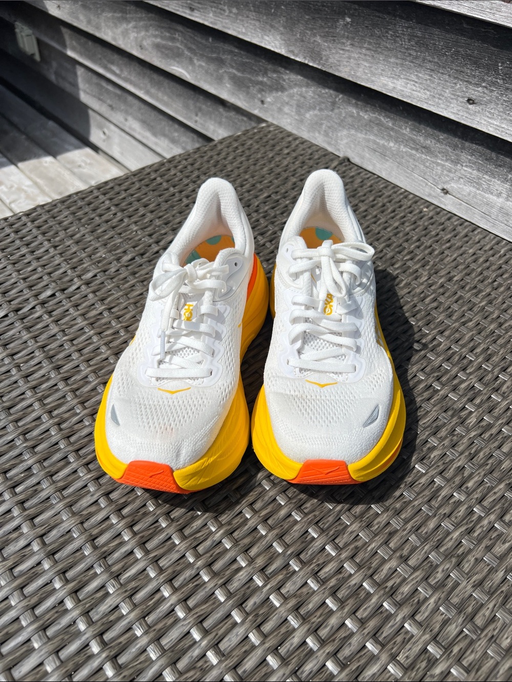 Hoka One One Bondi 9 White Sneakers with Yellow, Teal, and Orange Insole